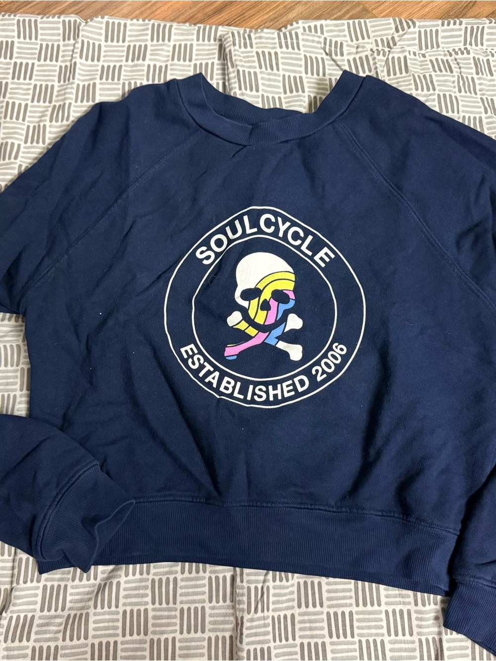 soulcycle navy crew sweatshirt with multicolor skull logo
